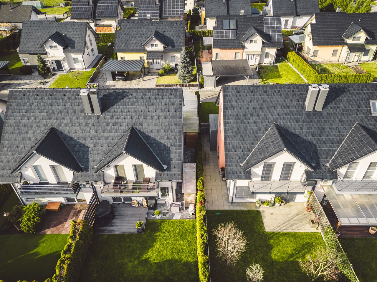 Aerial view of residential rooftops in a Houston-area neighborhood